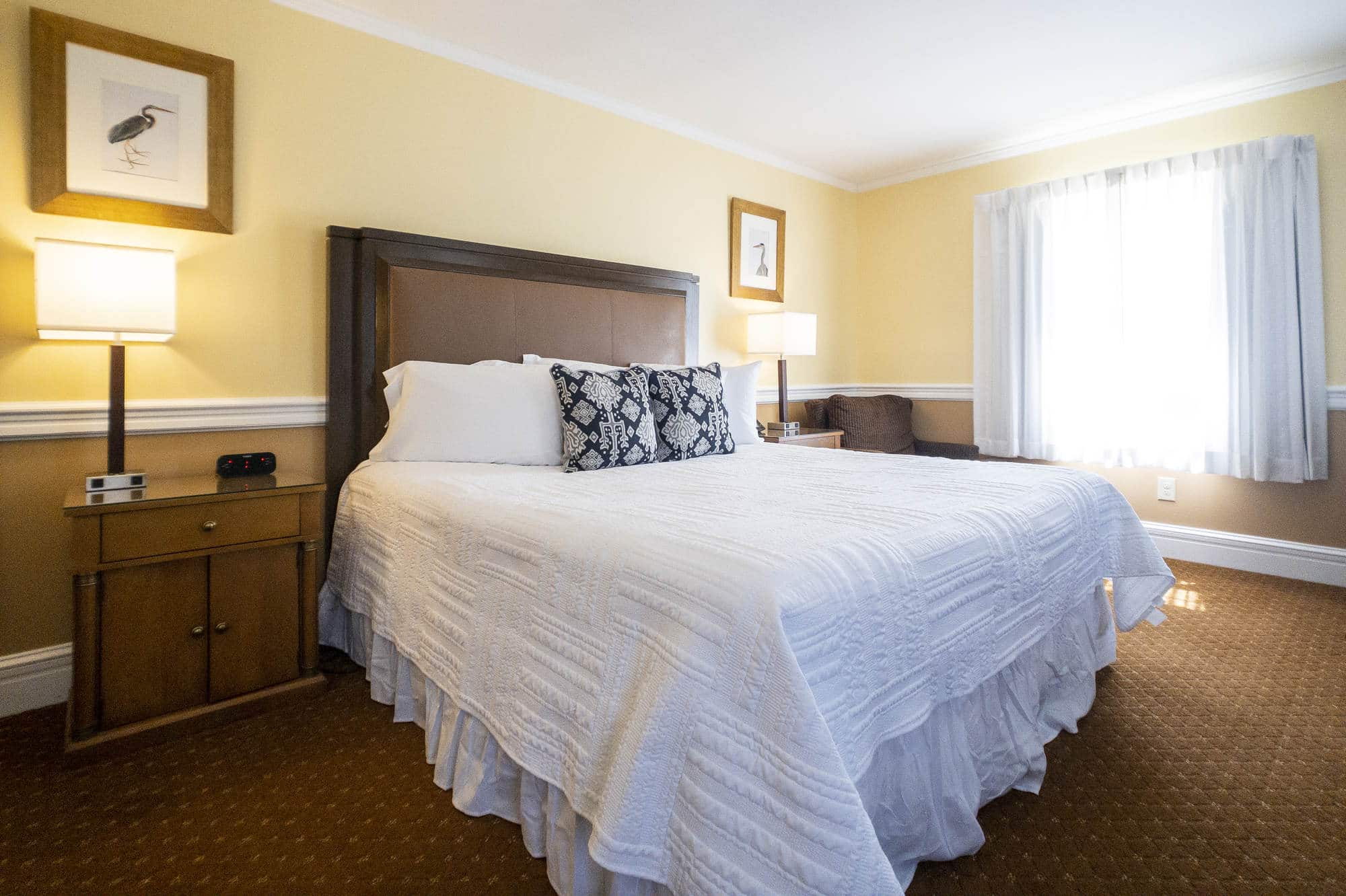 Queen bed in a guest room at the Inn on the Square boutique hotel in Greenwood, South Carolina.